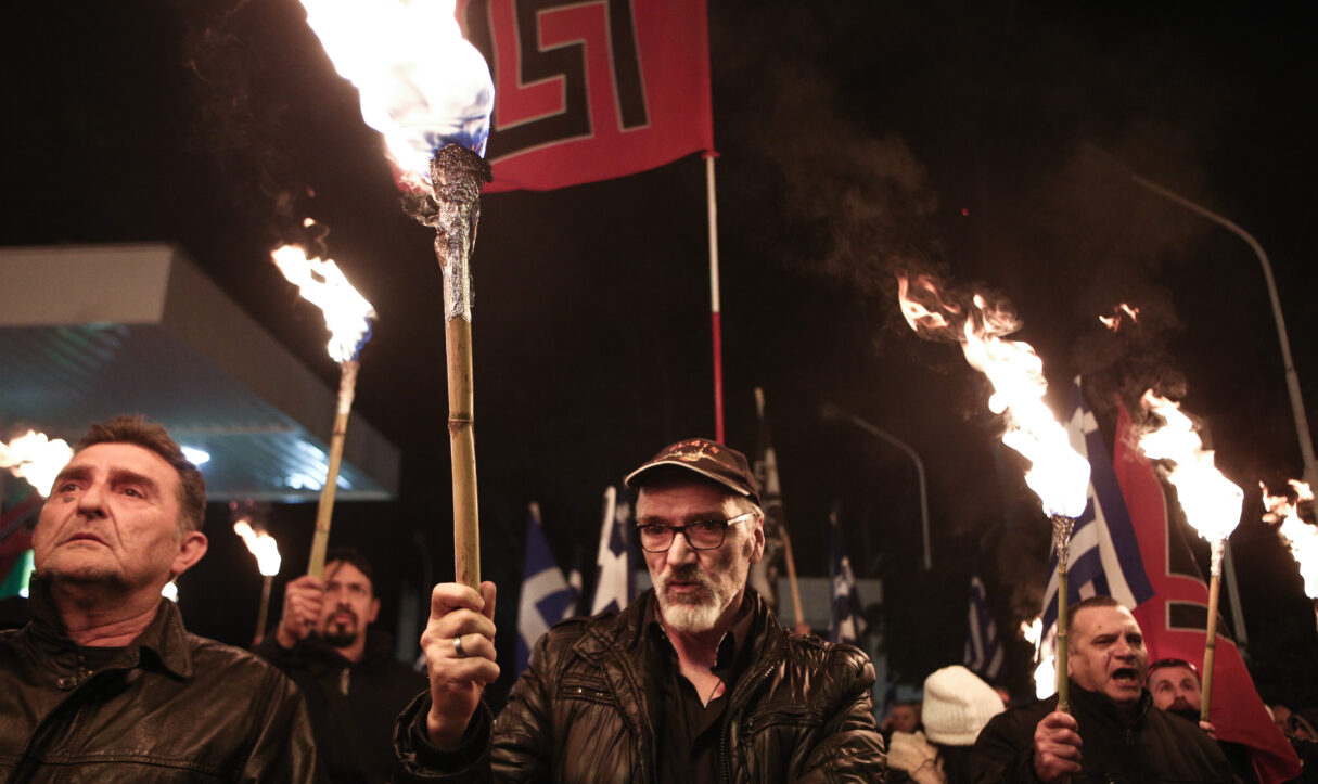 Golden Dawn supporters hold lit torches during a far-right rally in Athens on Feb. 3, 2018 (Nick Paleologos)