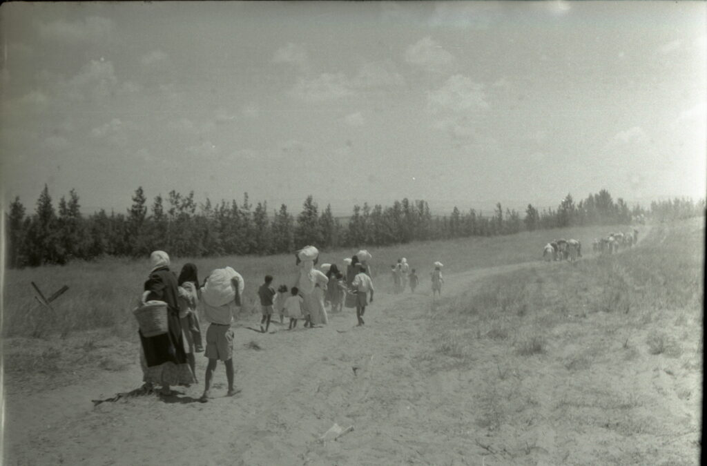 In June 1948, Palestinian women from the village of Tantura flee to Jordan under the supervision of the United Nations and the Red Cross (Benno Rothenberg/Meitar Collection/National Library of Israel/Pritzker Family National Photography Collection)