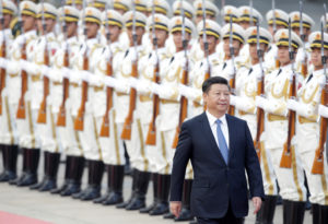 China's President Xi Jinping reviews honour guards during a welcoming ceremony in Beijing Inkstick Media