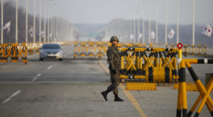 south Korean soldier patrols at a checkpoint on the Grand Unification Bridge, which leads to the demilitarized zone separating North Korea from South Korea, in Paju inkstick media foreign policy military option