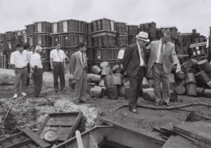 Okinawa officials visit a dumpsite of surplus US herbicides in southern Okinawa, 1971. / Okinawa Prefectural Archives