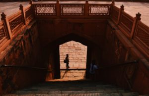 a man looking up the stairs