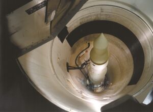 View down an eighty foot deep missile silo with a missile at the ready.