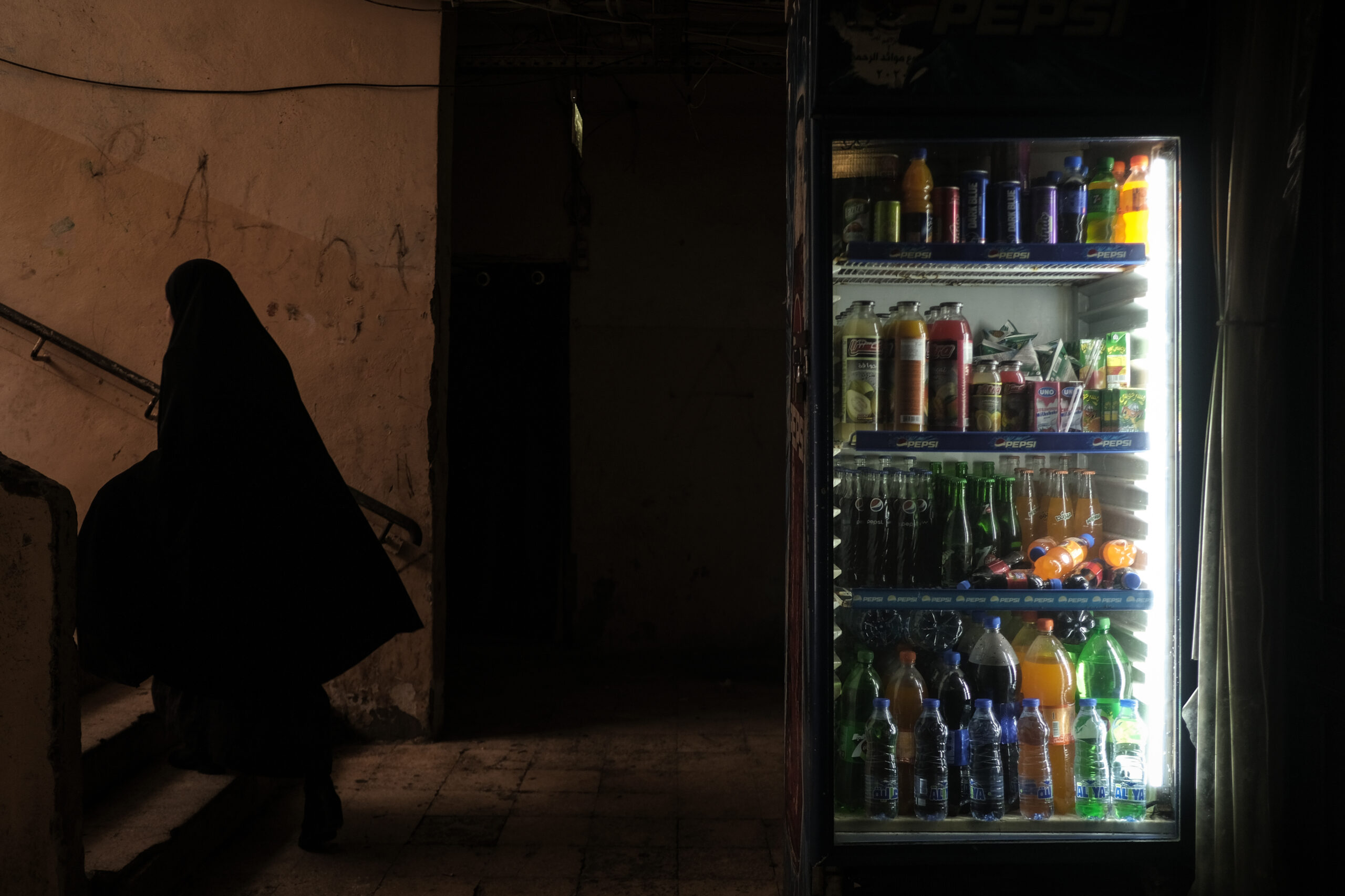 A woman walks up a stairwell in Beirut's Gaza hospital (João Sousa)