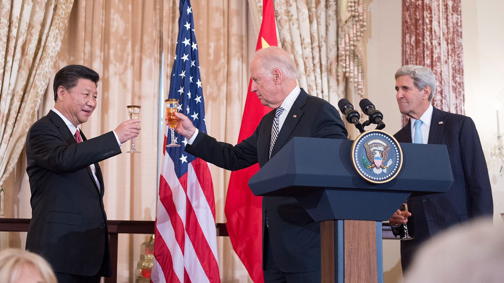 With U.S. Secretary of State John Kerry looking on, U.S. Vice President Joe Biden raises his glass to toast Chinese President & Communist Party general secretary Xi Jinping at a State Luncheon in the Chinese leader's honor at the U.S. Department of State in Washington, D.C., on September 25, 2015. [State Department photo/ Public Domain]