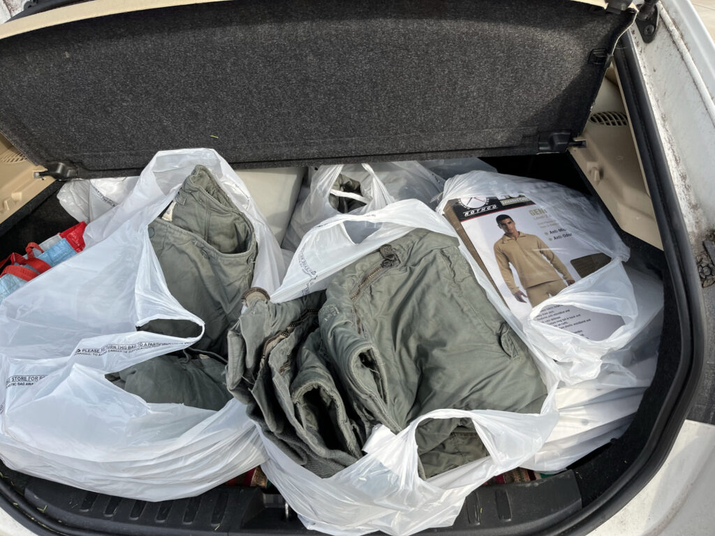 The hockey bag full of winter clothes from the army surplus store