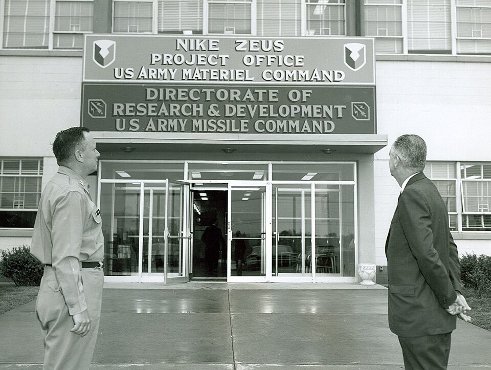 Col. Ivey Drewry and C.A. Warren of Bell Labs inspect the new NIKE-ZEUS Project Office sign at bldg. 4505, Redstone Arsenal, Ala..