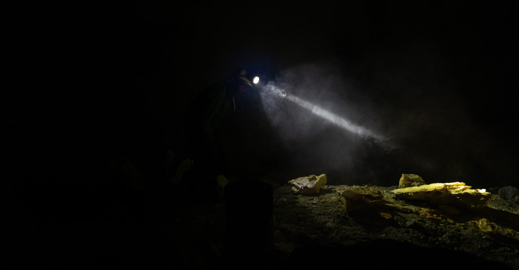 Meanwhile, a miner prepares to haul his sulfur haul out of the crater (Alexandros Zilos)