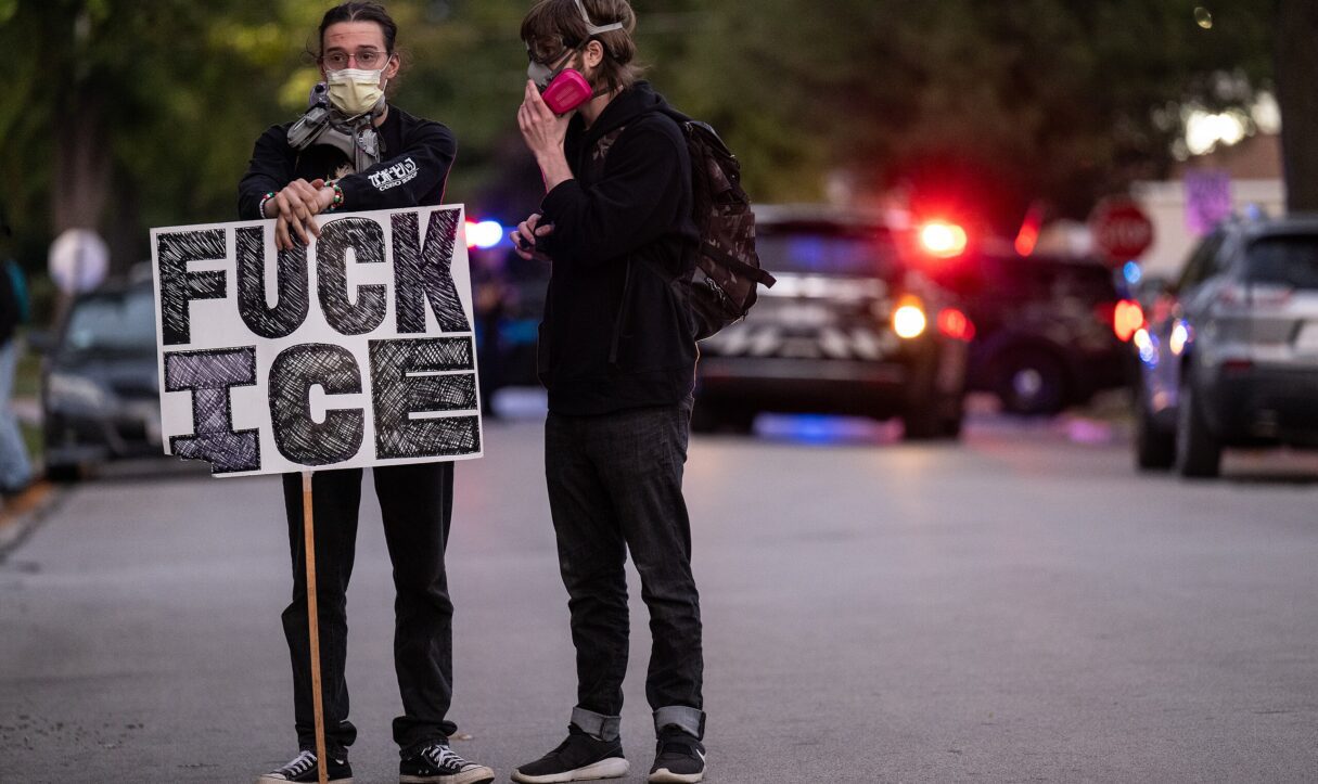 A demonstrator holds an anti-ICE sign during a rally in Chicago in October 2025 (Paul Goyette/Wikimedia Commons)