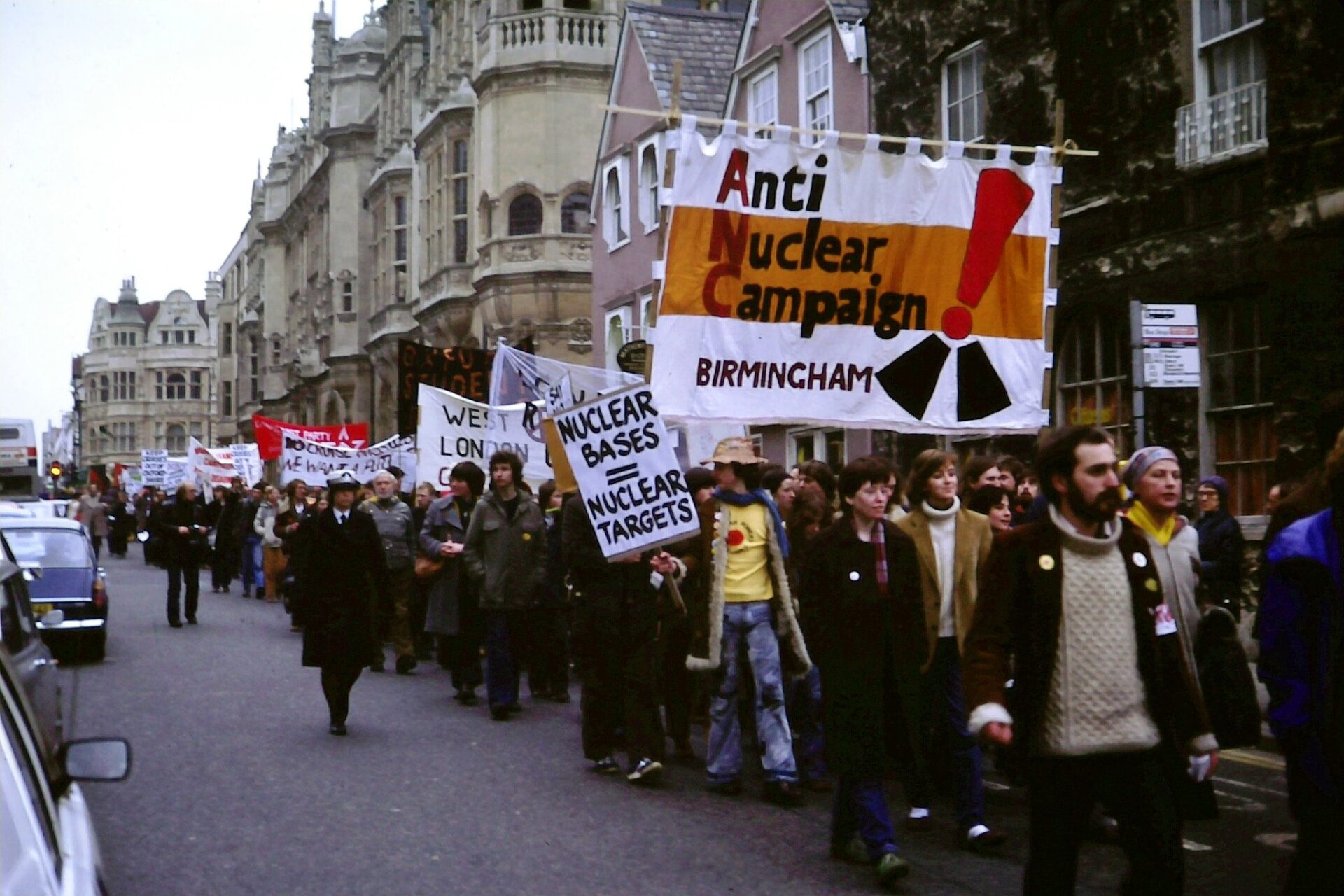Anti-nuclear weapons protest march, Oxford, England, 1980. The protestors, seen here marching past Oxford's Town Hall, were objecting to the proposed stationing of cruise missiles at the U.S. Air Force base at Upper Heyford (Kim Traynor via Wikimedia Commons)