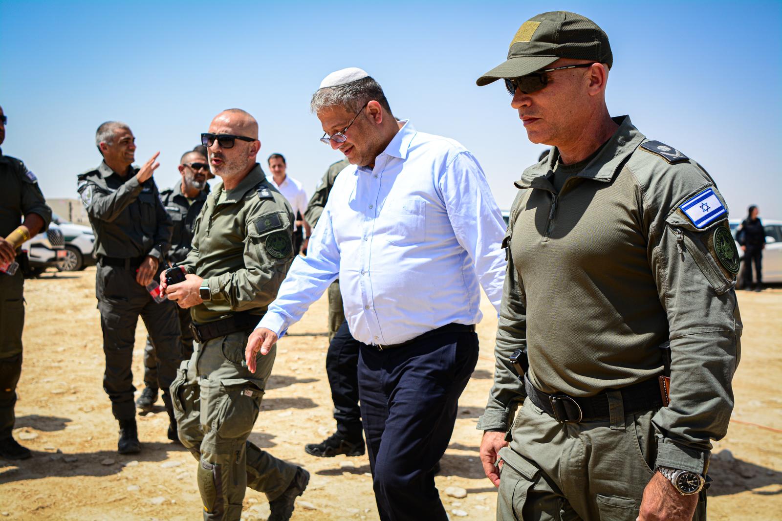 Israeli National Security Minister Itamar Ben-Gvir walks alongside police in May 2025 (Israel Police/Wikimedia Commons)
