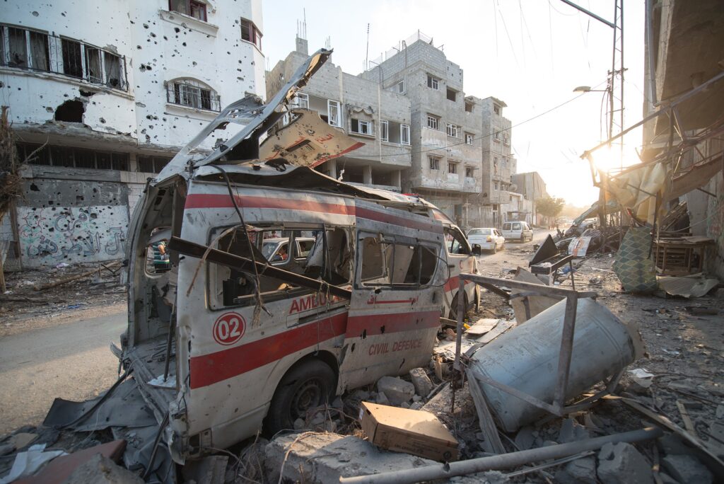 Taken during a temporary truce on Aug. 6, 2014, this photo shows a destroyed ambulance in the Shuja'iyya area of Gaza (Boris Niehaus/Wikimedia Commons)