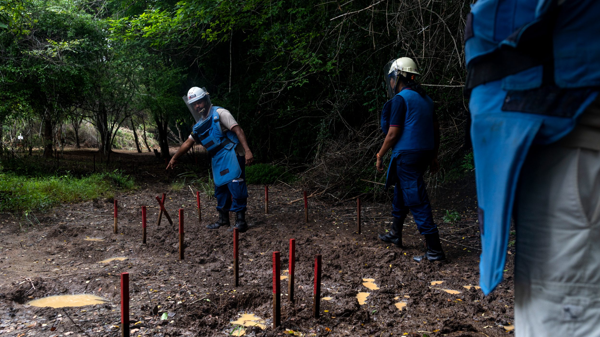 A demining team attempts to secure a forested area in Sri Lanka (Dimitra Margariti)