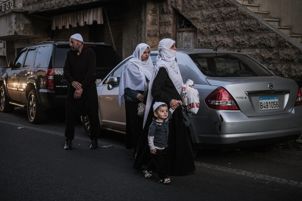 A family arrives at the main square in Baysour just before sunrise for the town’s annual Liqaa al-Eid tradition (João Sousa)