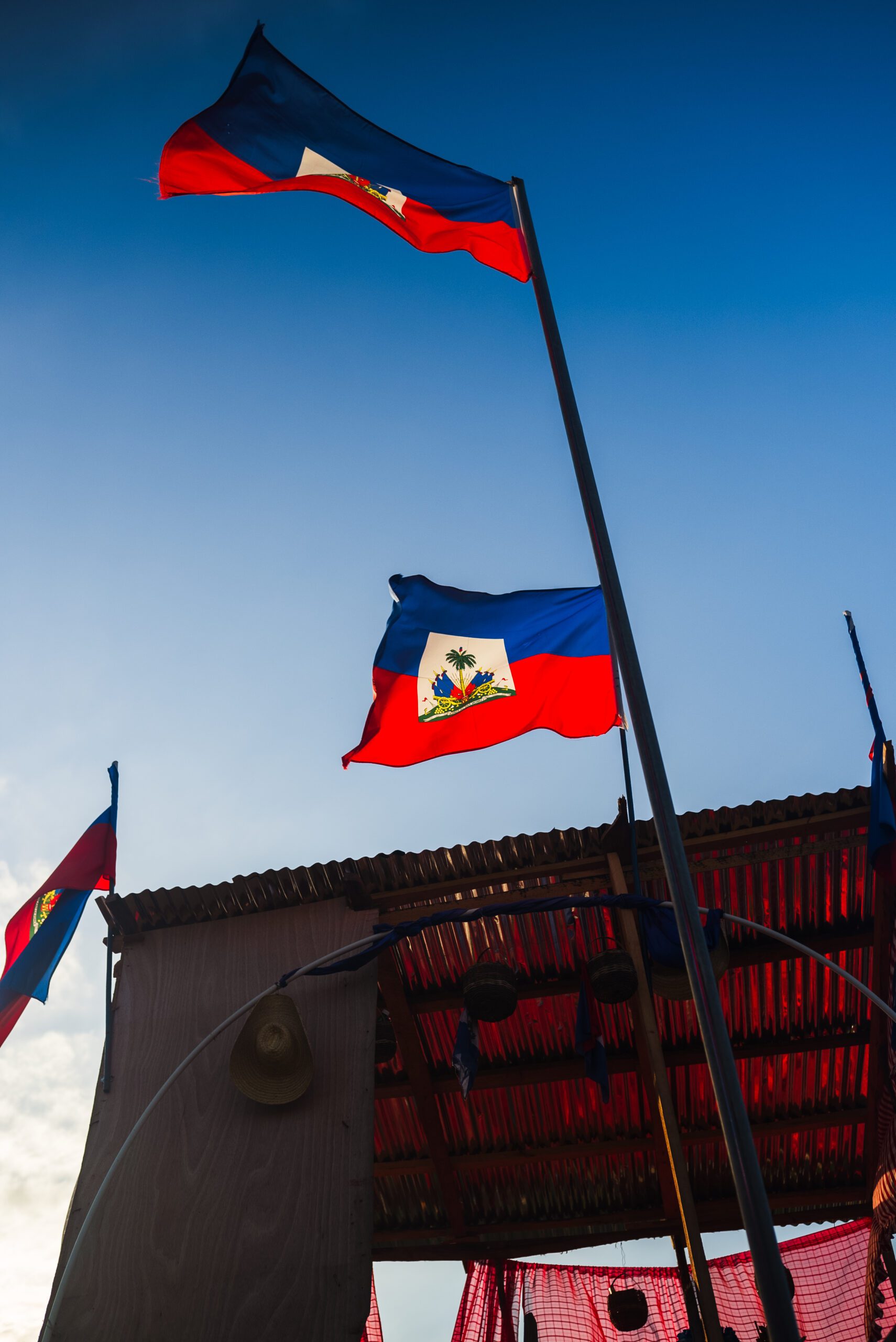 Haitian flags fly near the construction of the canal in Ouanaminthe.