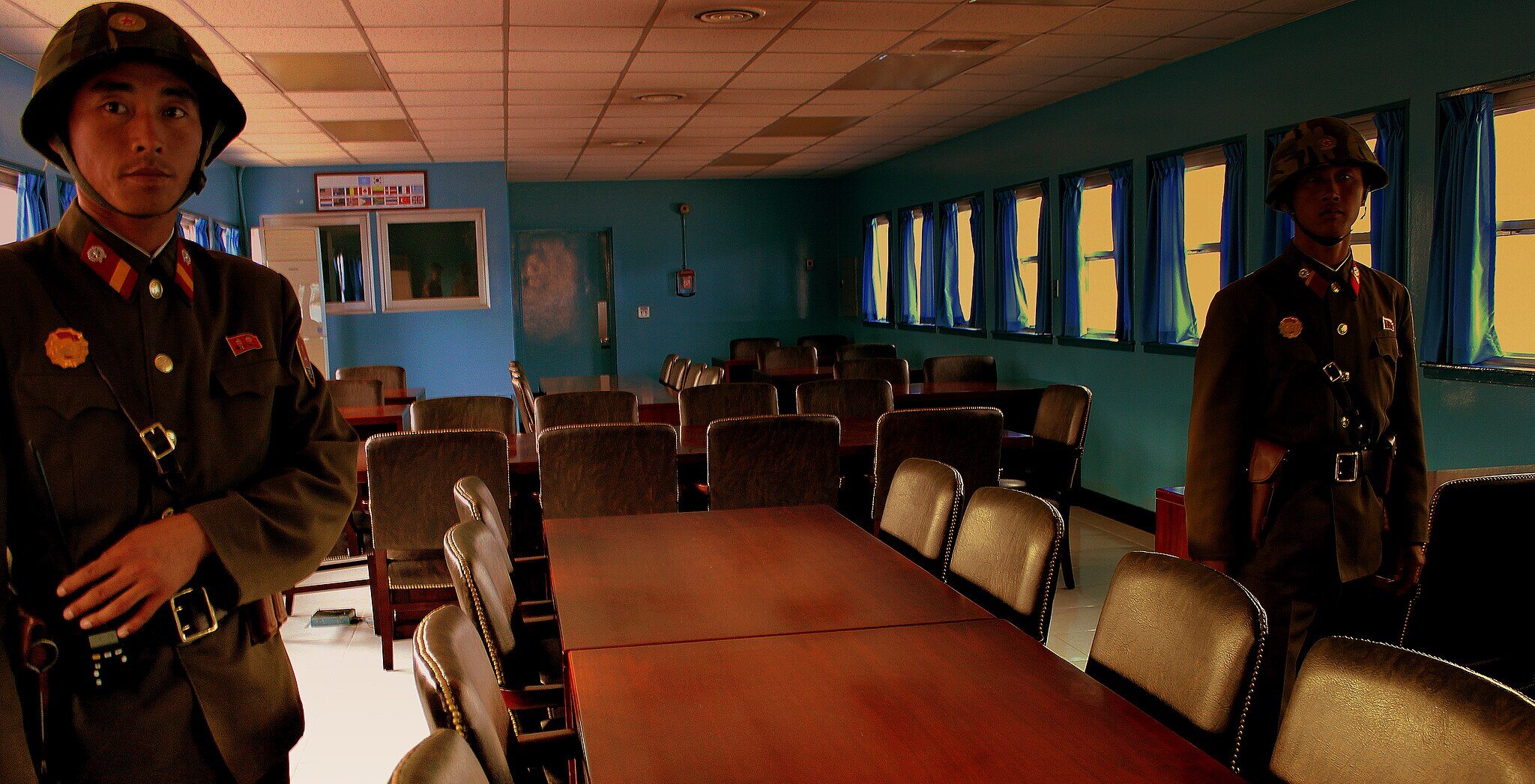 North Korean soldiers guard one of the buildings at Panmunjom village in the Demilitarized Zone in October 2012 (Wikimedia Commons)