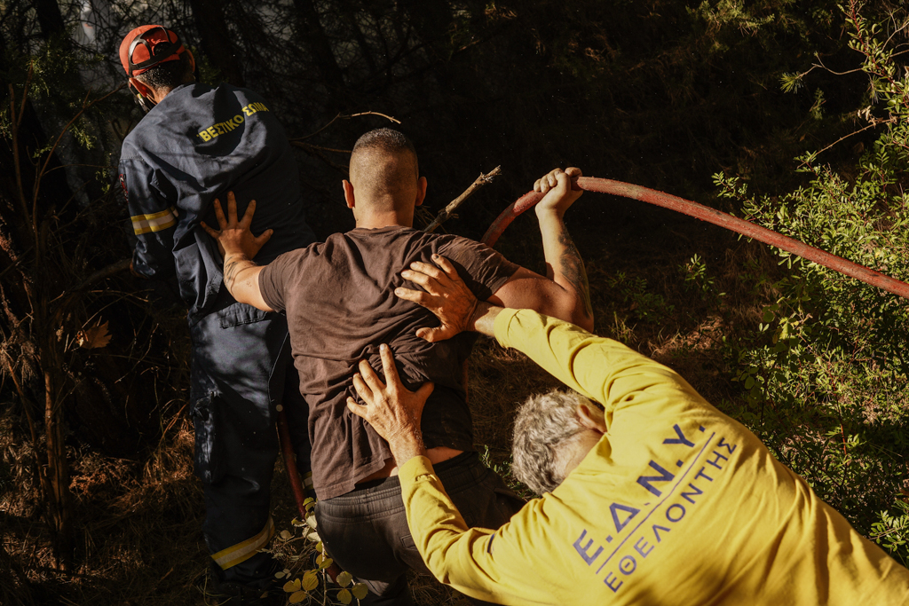 Local volunteers joined the push to fight wildfires in Varnavas on Aug. 11 (Nick Paleologos)