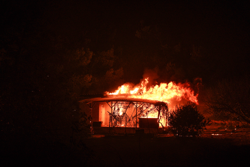 Flames tore through a farmhouse near Stamata overnight on Aug. 11 (Nick Paleologos)