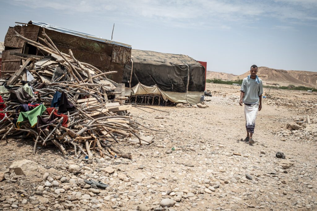 Hamse Abdiraman walks through the streets of one of the informal settlements on the outskirts of Bosaso (Marco Simoncelli)