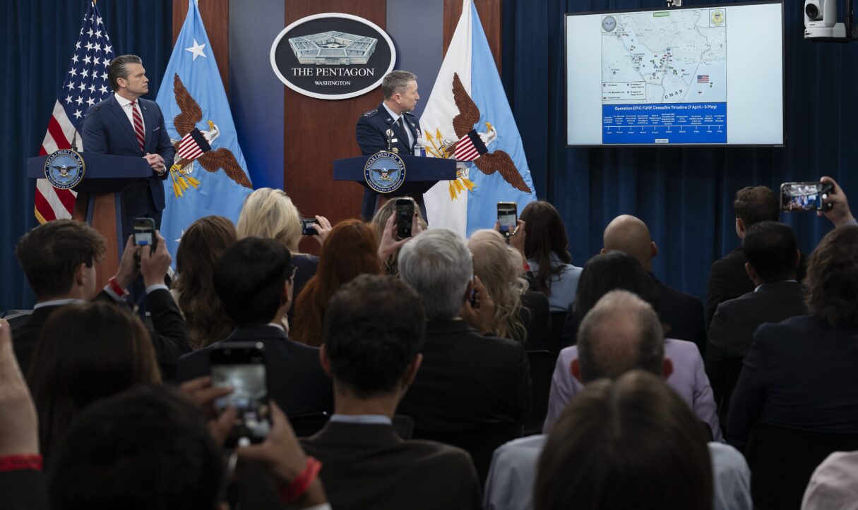 Secretary of Defense Pete Hegseth and General Dan Caine conduct a press briefing in 2026 (Madelyn Keech/US Air Force/Wikimedia Commons)
