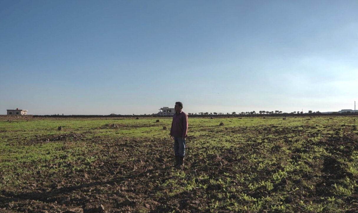 Sakhr Mahmoud al-Nader, 53, stands in his fields in the al-Rafid village of southern Syria (Anagha Subhash Nair)