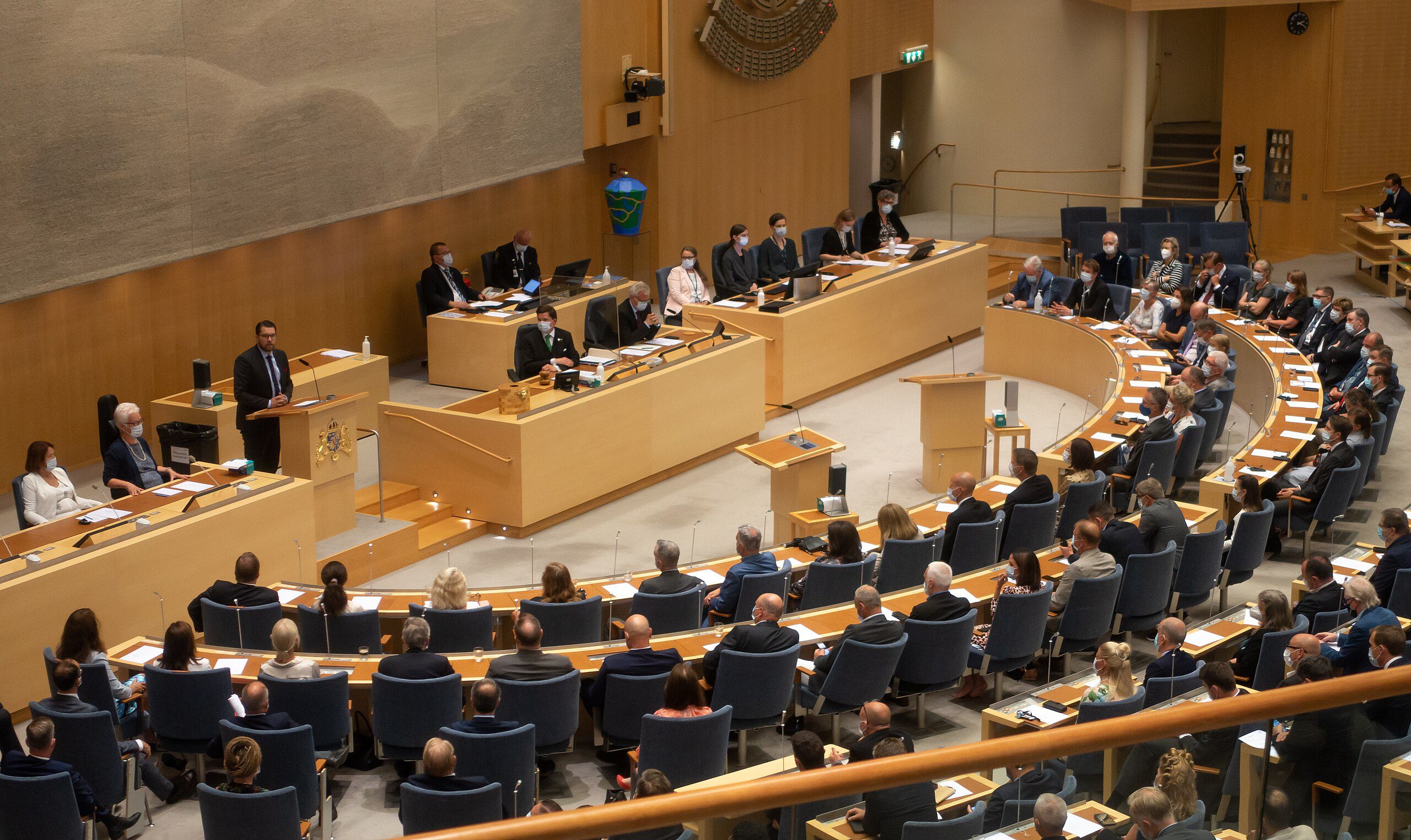 Far-right Sweden Democrats leader Jimmie Akesson at the lectern of the Swedish parliament in 2021 (Frankie Fouganthin/Wikimedia Commons)