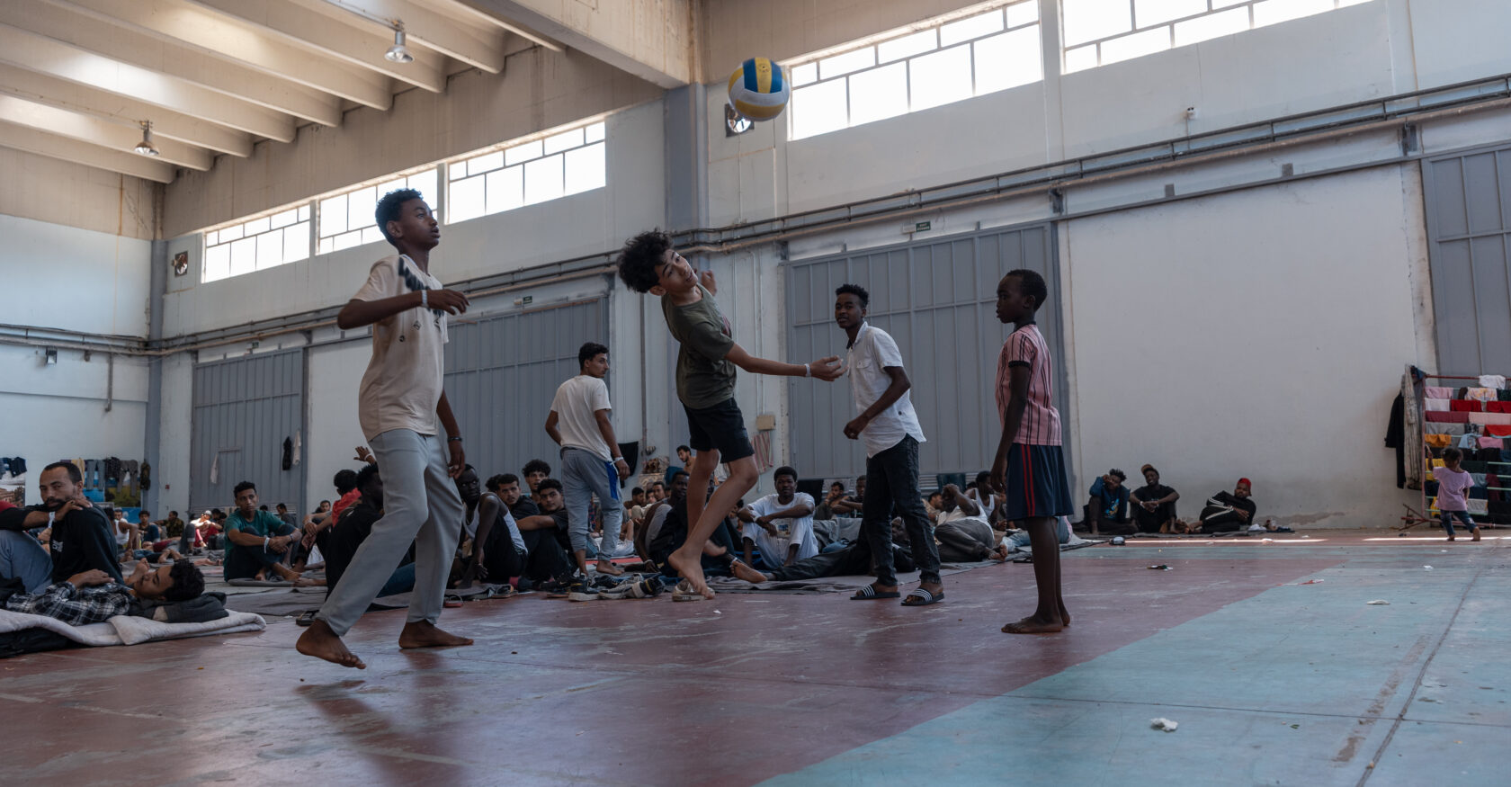 Young boys kick a soccer ball inside a refugee facility on Greece's Crete (Dimitra Margariti)