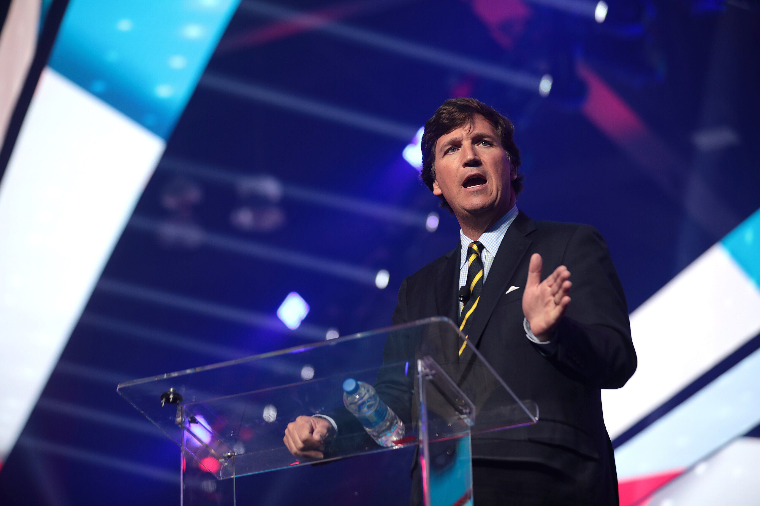 Tucker Carlson speaks to attendees of AmericaFest in Phoenix, Arizona, in December 2021 (Gage Skidmore/Wikimedia Commons)