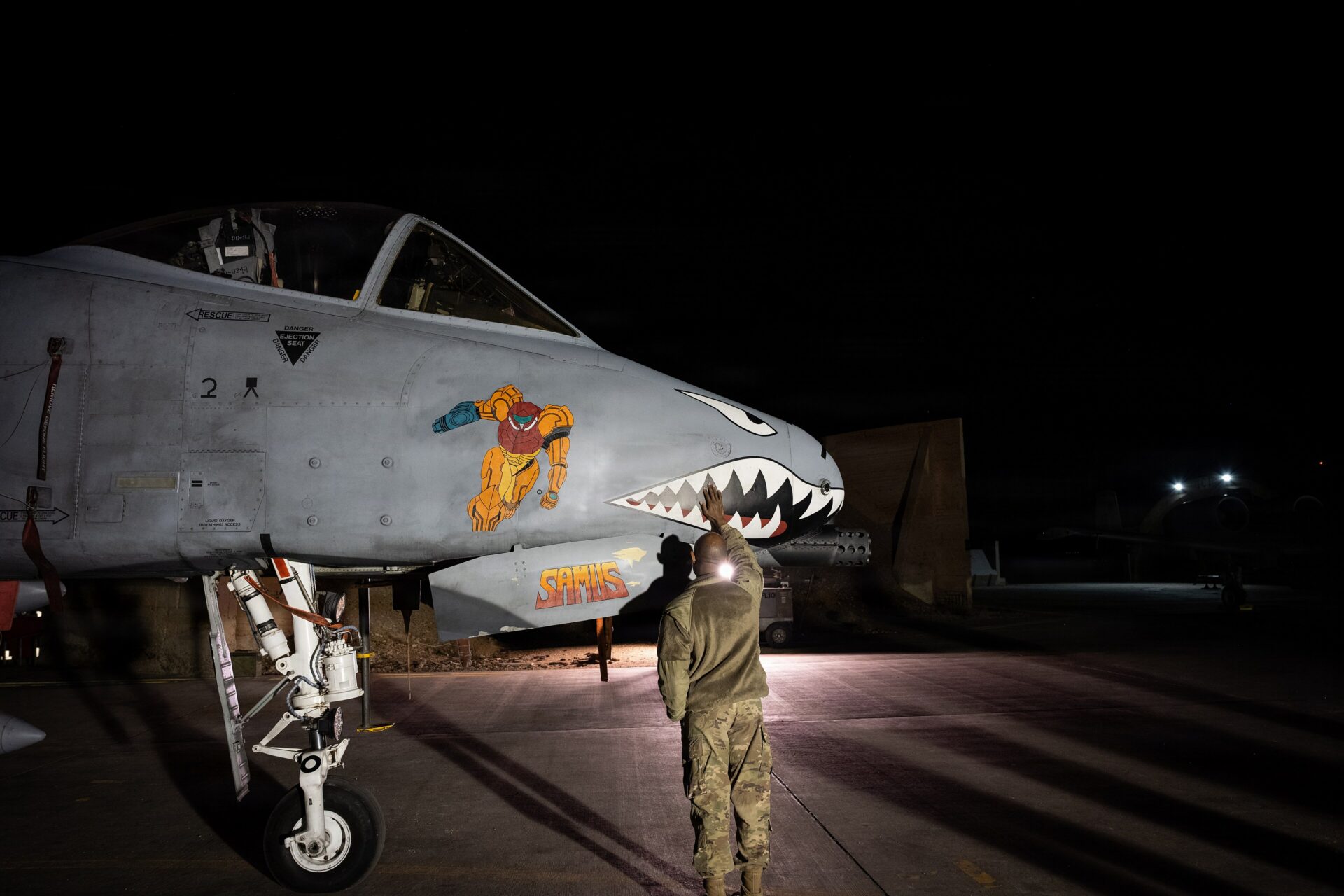 A US Air Force chaplain prays over military aircraft in December 2025 (US Air Force/Wikimedia Commons)