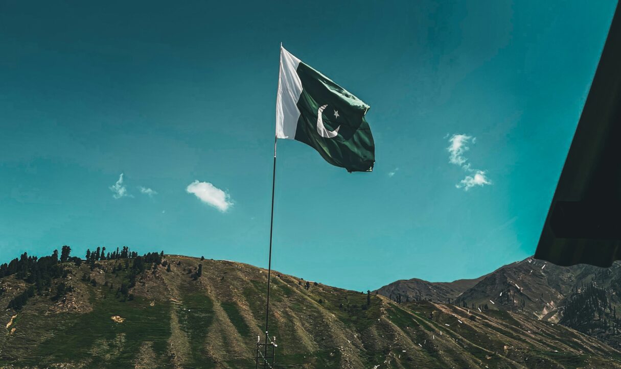 A photo shows a Pakistan flag near the Batakundi Eco Hotel in Pakistan (Ali Khokhar/Unsplash)