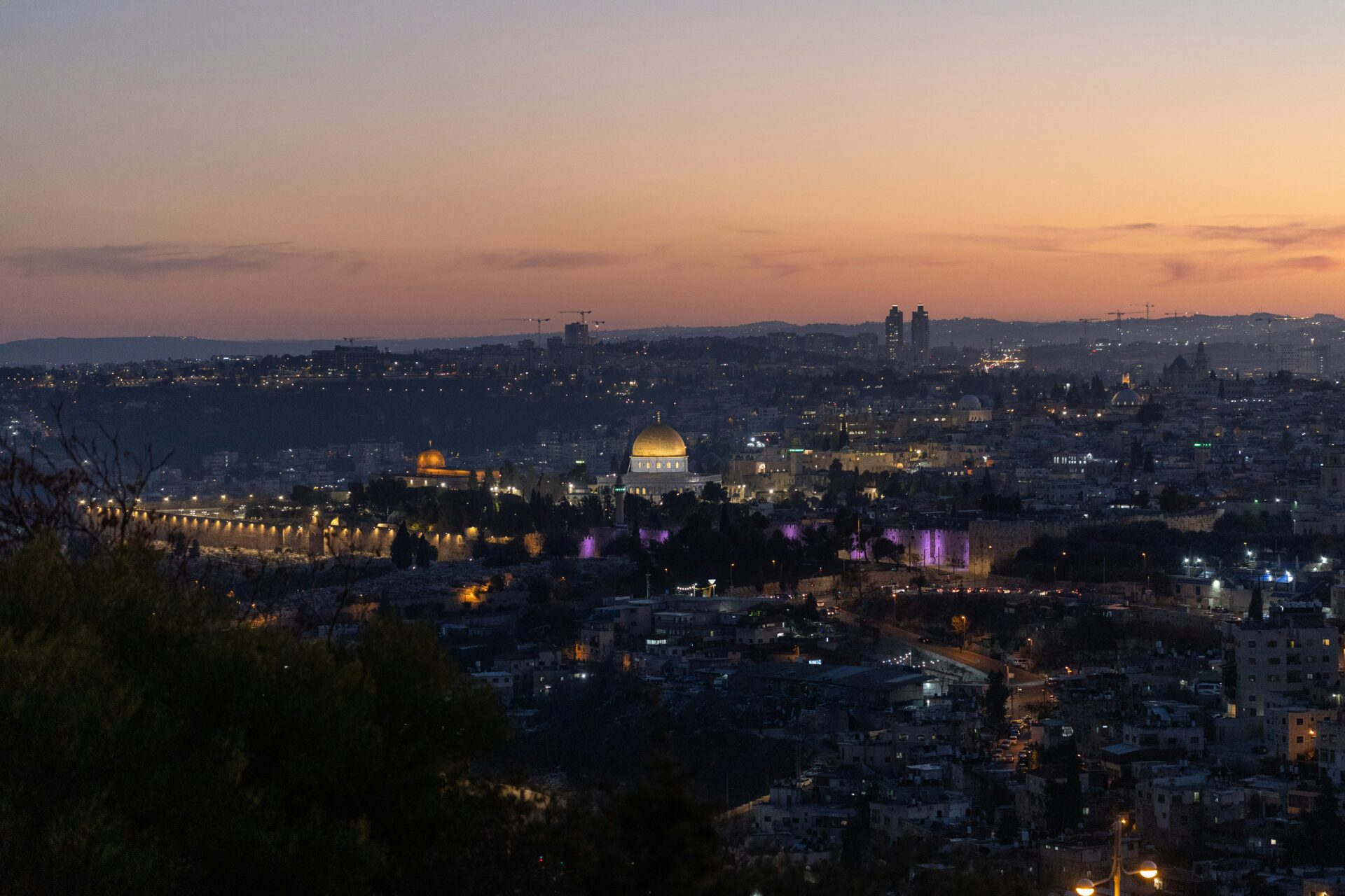 A photo shows Jerusalem at night (Amr Sandouka/Unsplash)