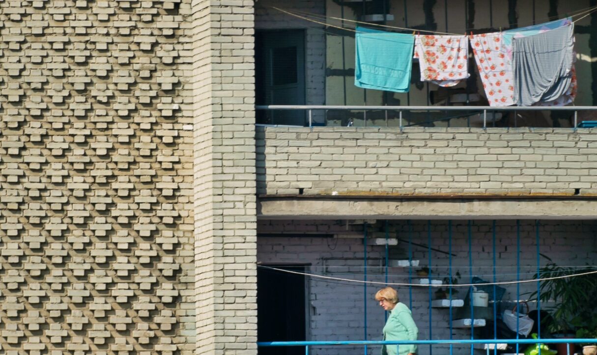 woman walking on balcony