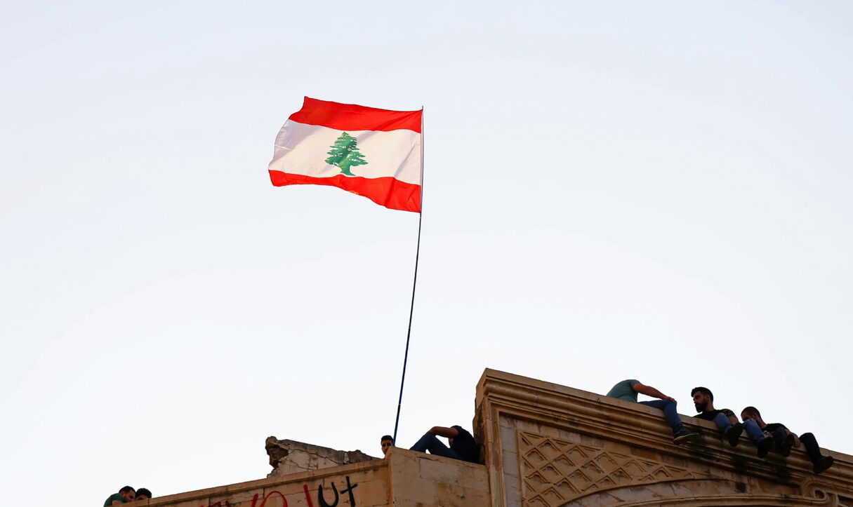 A Lebanse flag flies in Beirut, Lebanon in April 2021 (Charbel Karam/Unsplash)