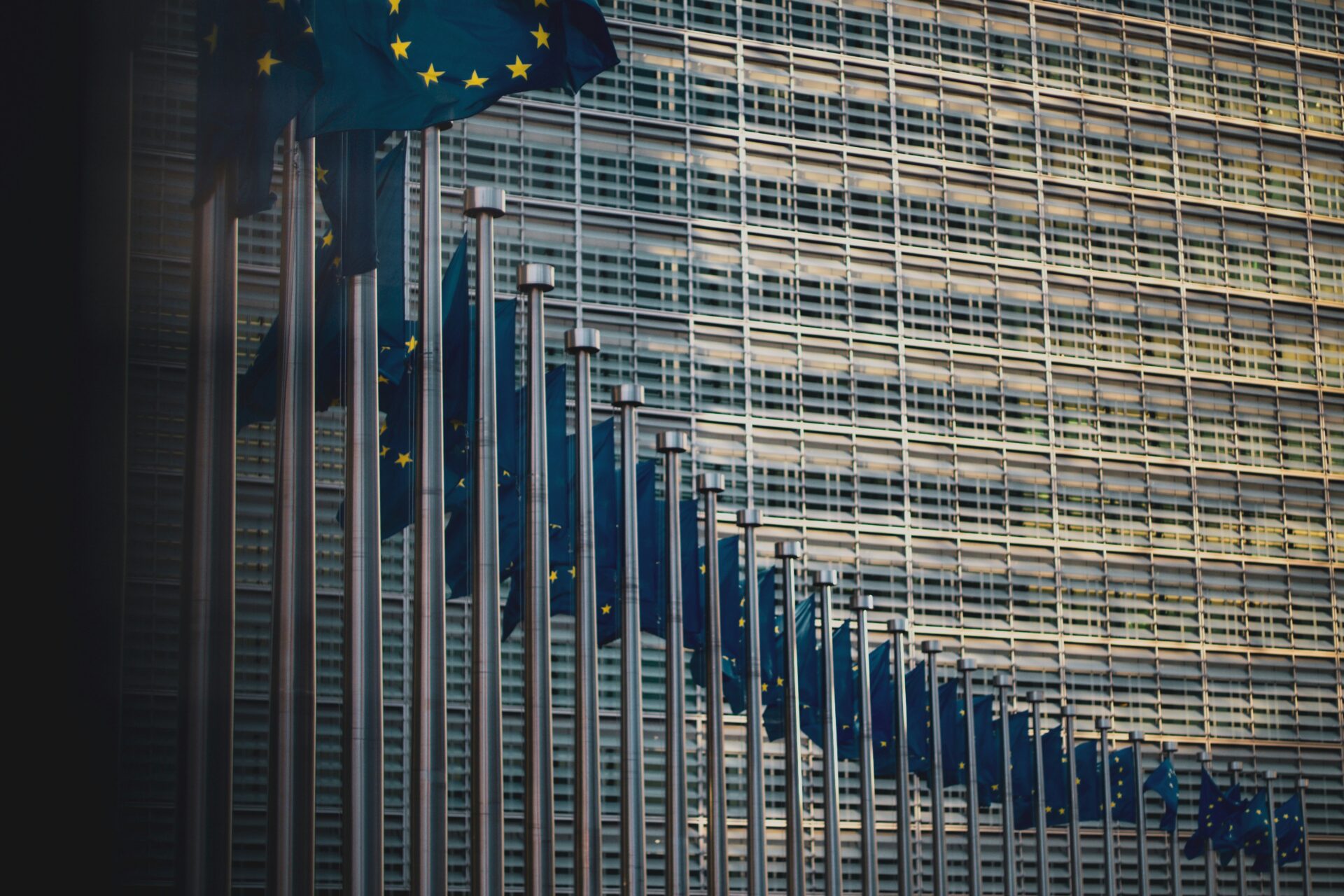 Flags of the member states of the European Union in front of the EU-commission building "Berlaymont" in Brussels, Belgium (Christian Lue via Unsplash)