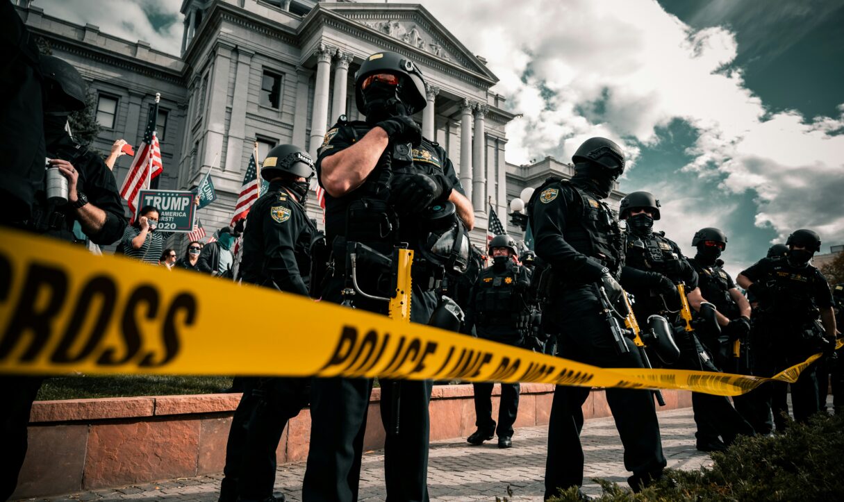 A photo shows police in Denver in front of a pro-Trump rally in March 2021 (Colin Lloyd/Unsplash)