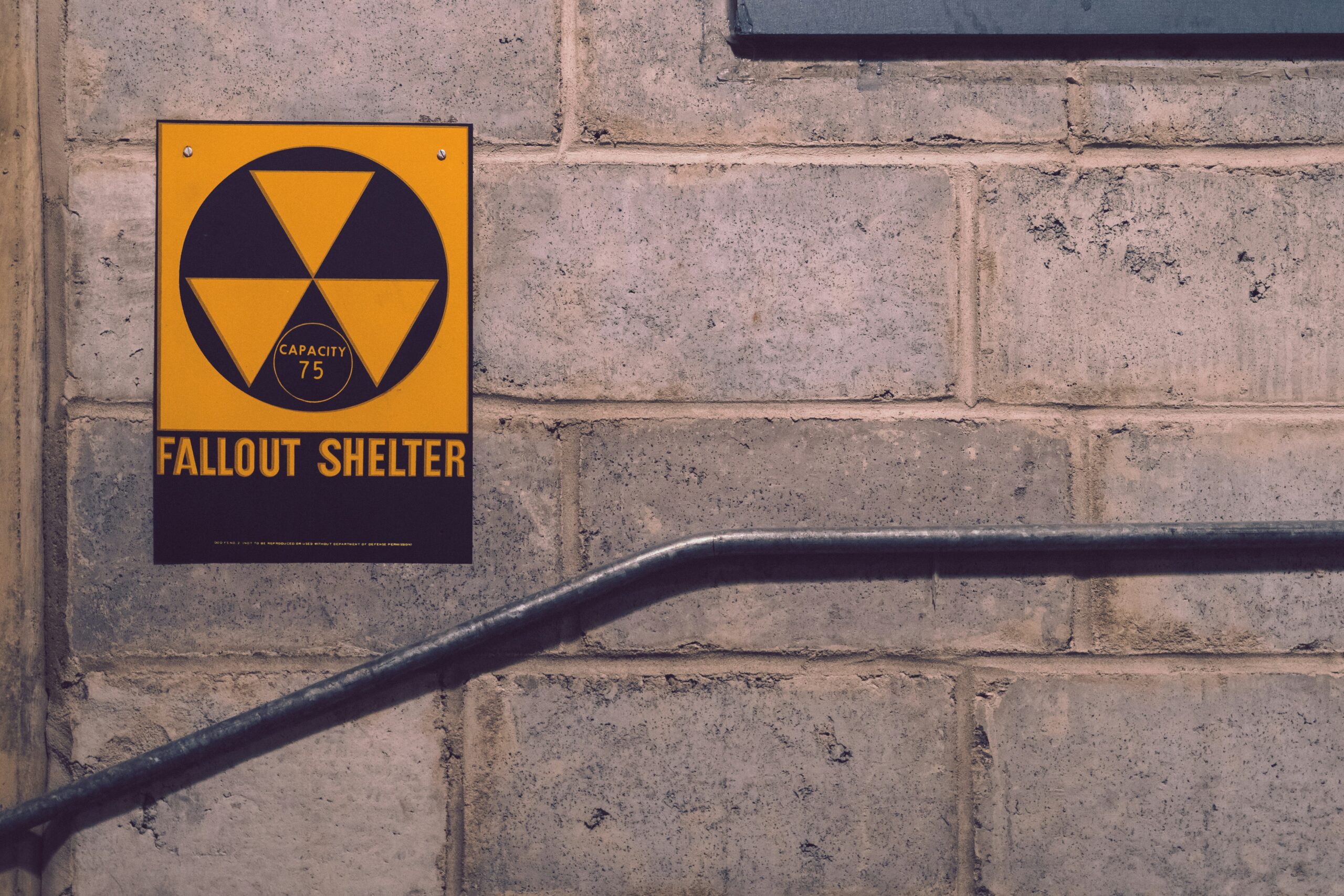 In the basement of a fallout shelter in Idaho, a sign informs passersby of a nuclear fallout shelter (Dan Meyers/Unsplash)