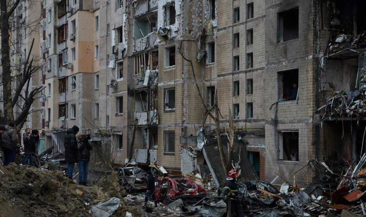 In January 2024, residents survey the damage of their missile-hit building in Kyiv, Ukraine (Dmytro Tolokonov/Unsplash)