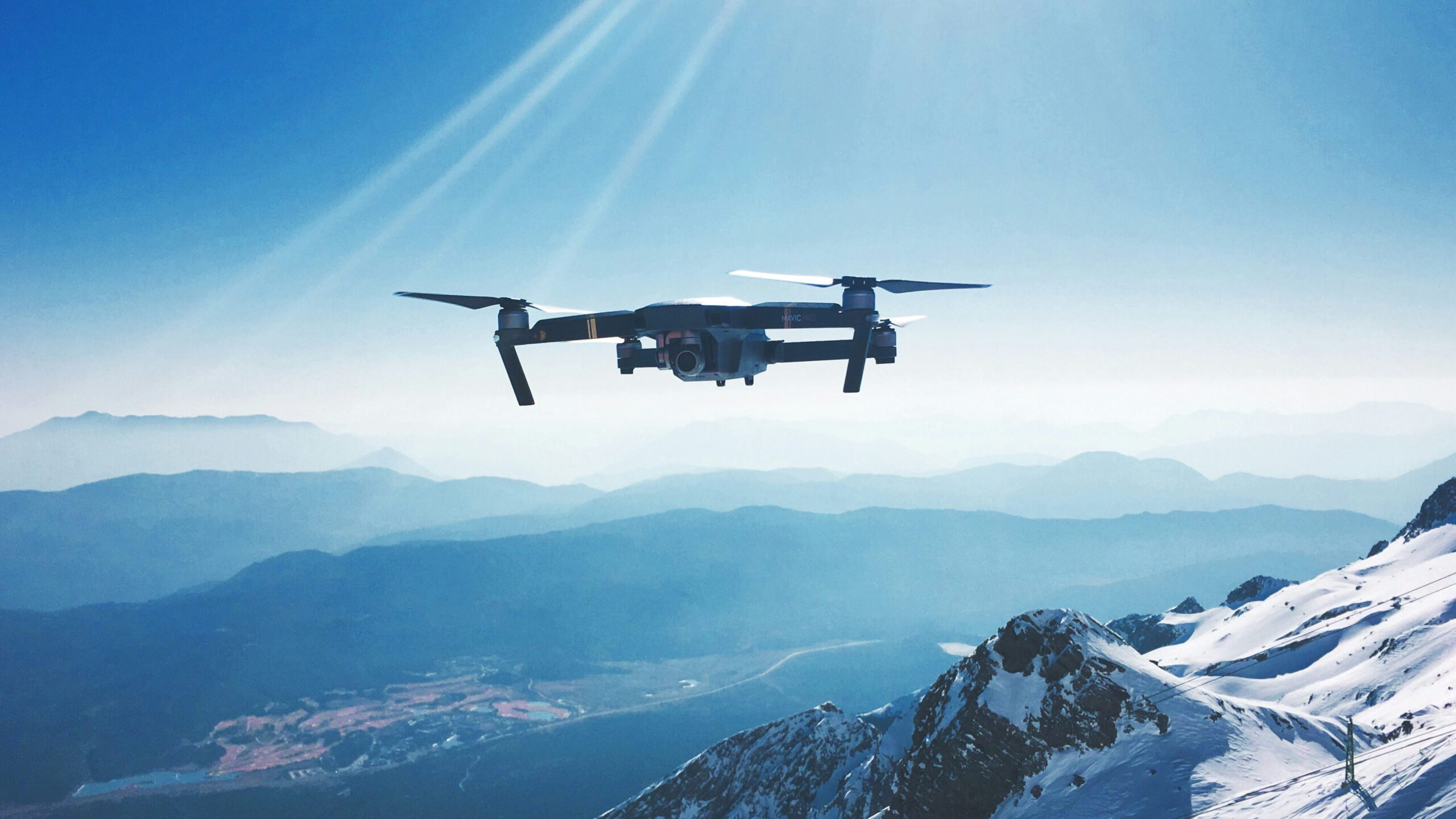 A drone photographed as it flew above China's YuLong Mountain in February 2017 (Iewek Gnos/Unsplash)