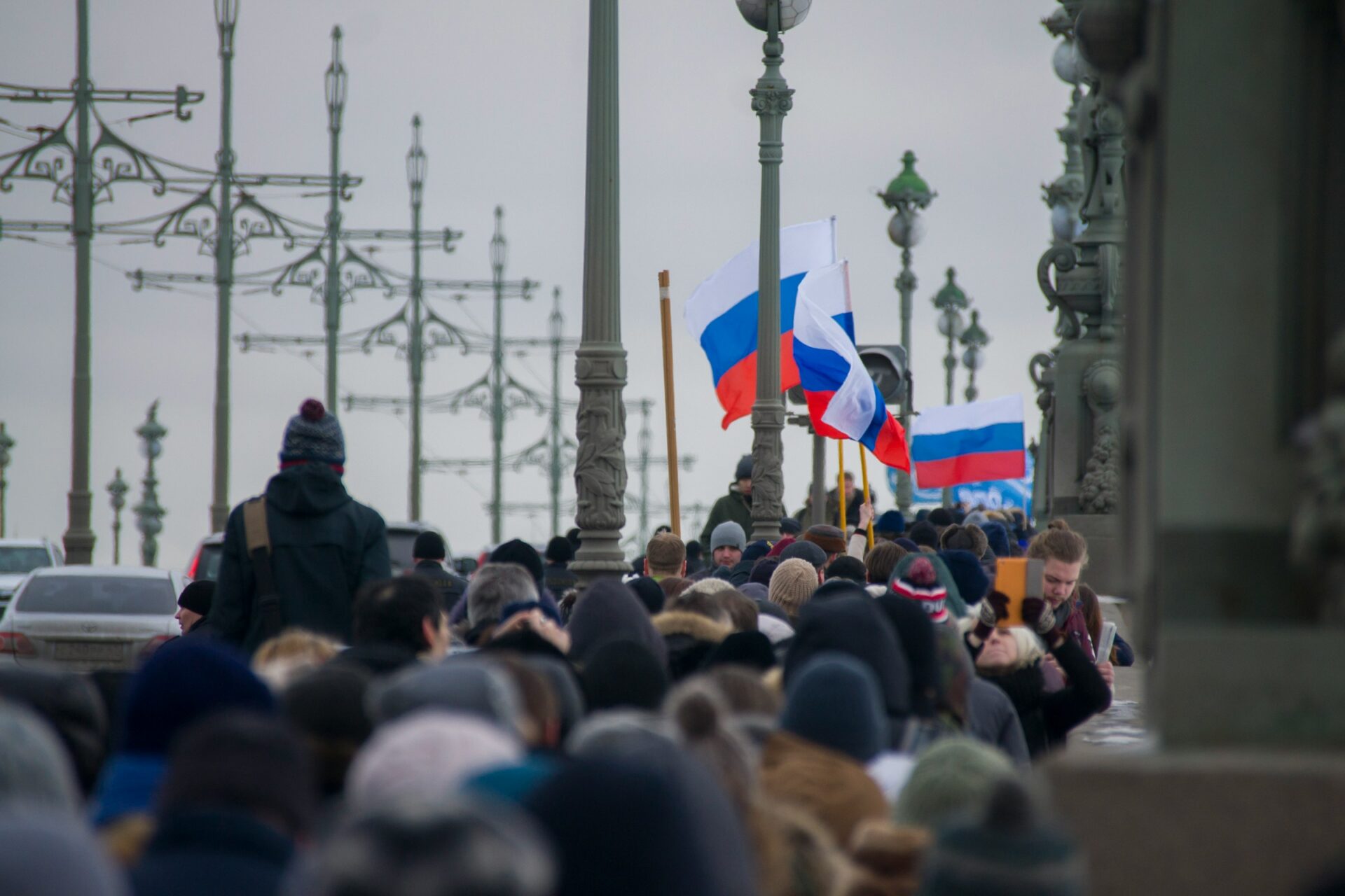 This is a photo of a protest which was held a year later famous Russian liberal politician Boris Nemtsov was killed. Photo was taken on Trinity Bridge in Saint Petersburg (Klaus Wright via Unsplash)