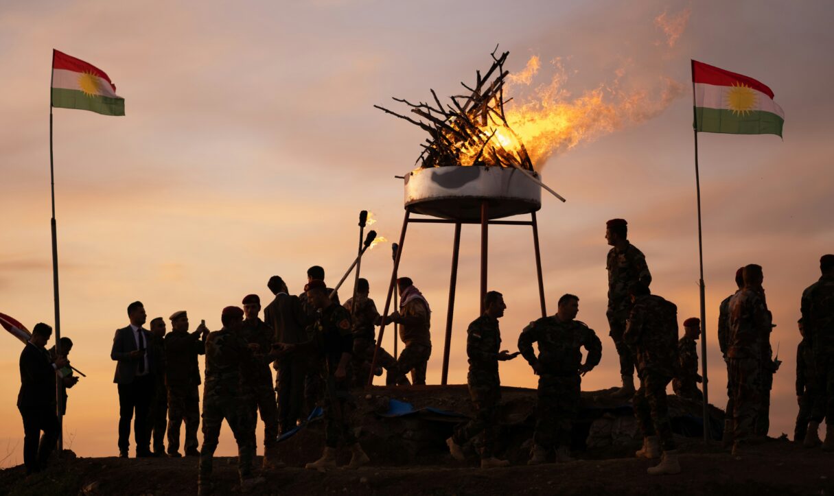 Peshmerga light a bonfire on the frontlines to celebrate the Nowruz holiday in 2021 (Levi Meir Clancy/Unsplash)