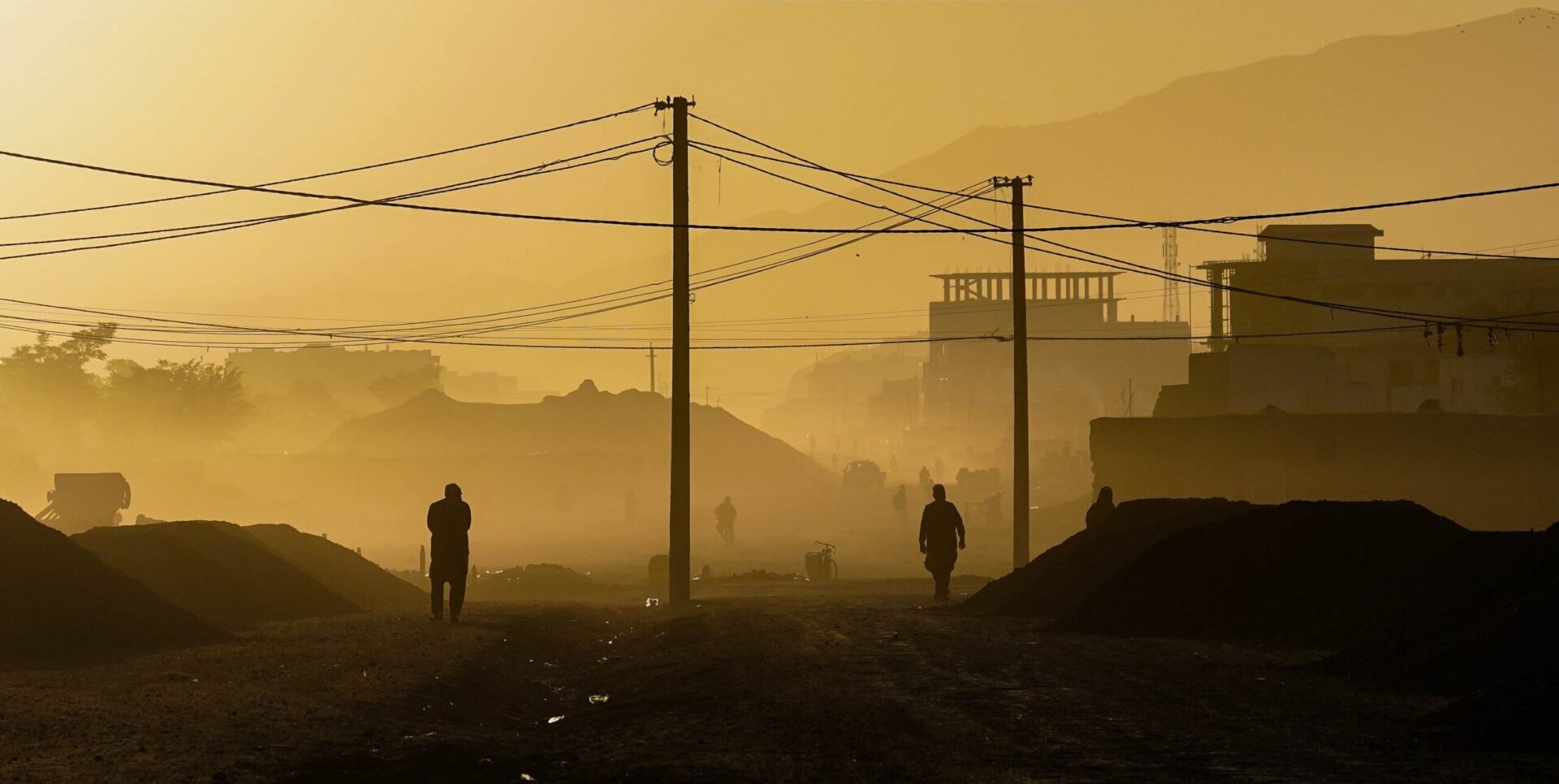 On Sept. 25, 2020, Afghans walk along the streets during dawn in Kabul, Afghanistan (Mohammad Rahmani via Unsplash)
