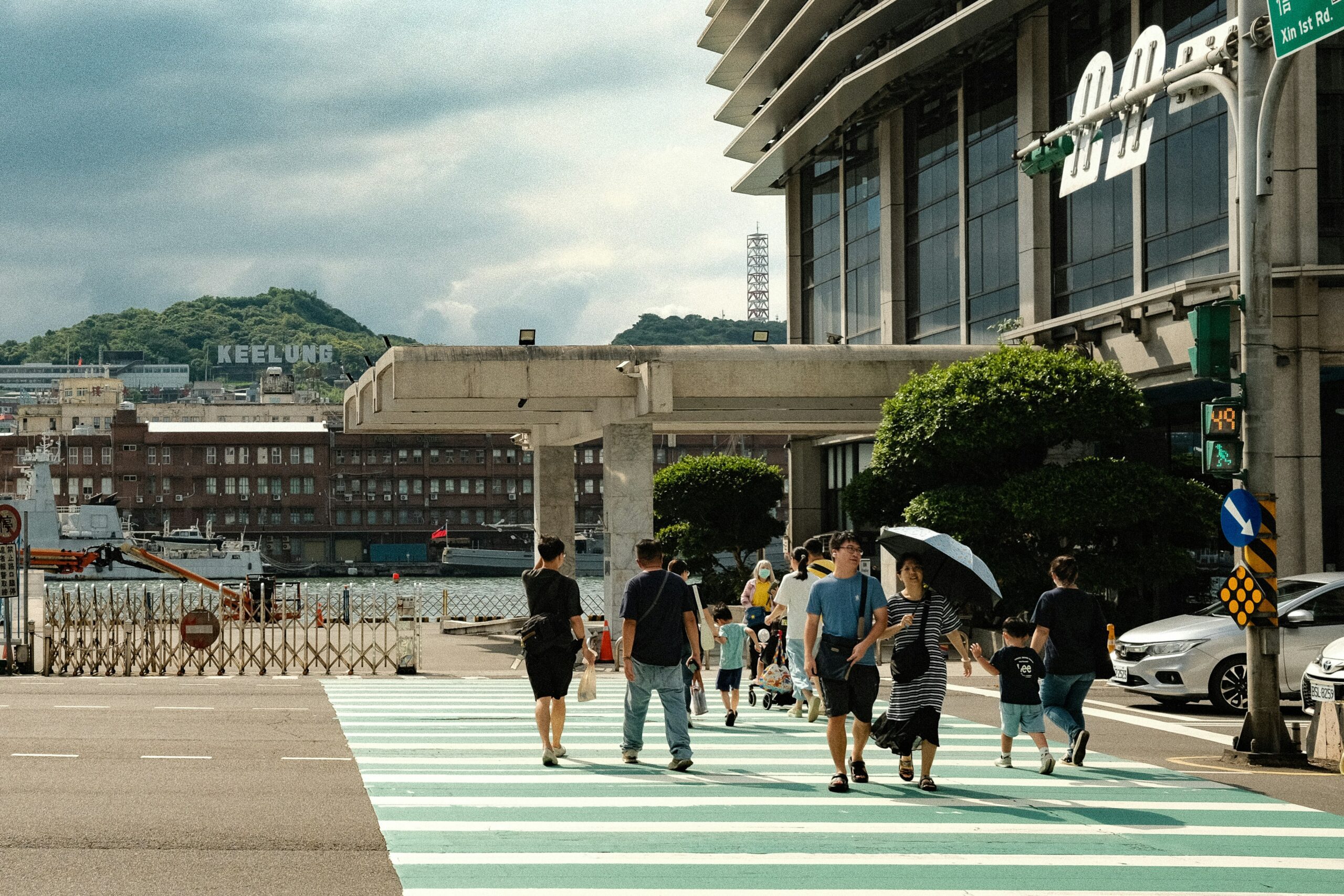 A photo shows people walking in Keelung, a port city in northern Taiwan, near Taipei. (Moralis Tsai/Unsplash)