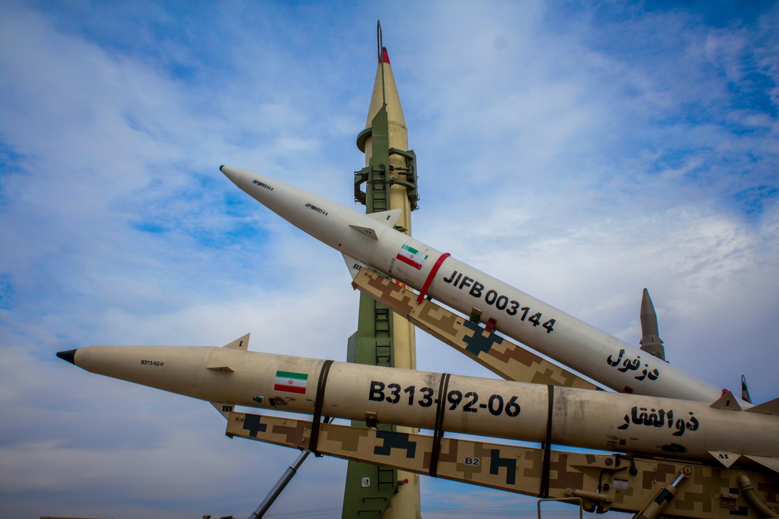 A photo shows display missiles with Iranian flags in January 2025 (Moslem Daneshzadeh/Unsplash)