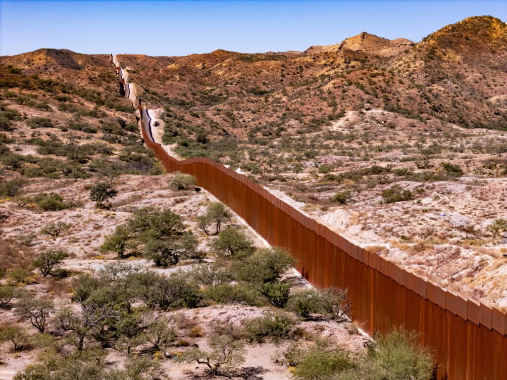 The US-Mexico border wall photographed near Arivaca, Arizona, in October 2024 (Nils Huenerfuerst/Unsplash)