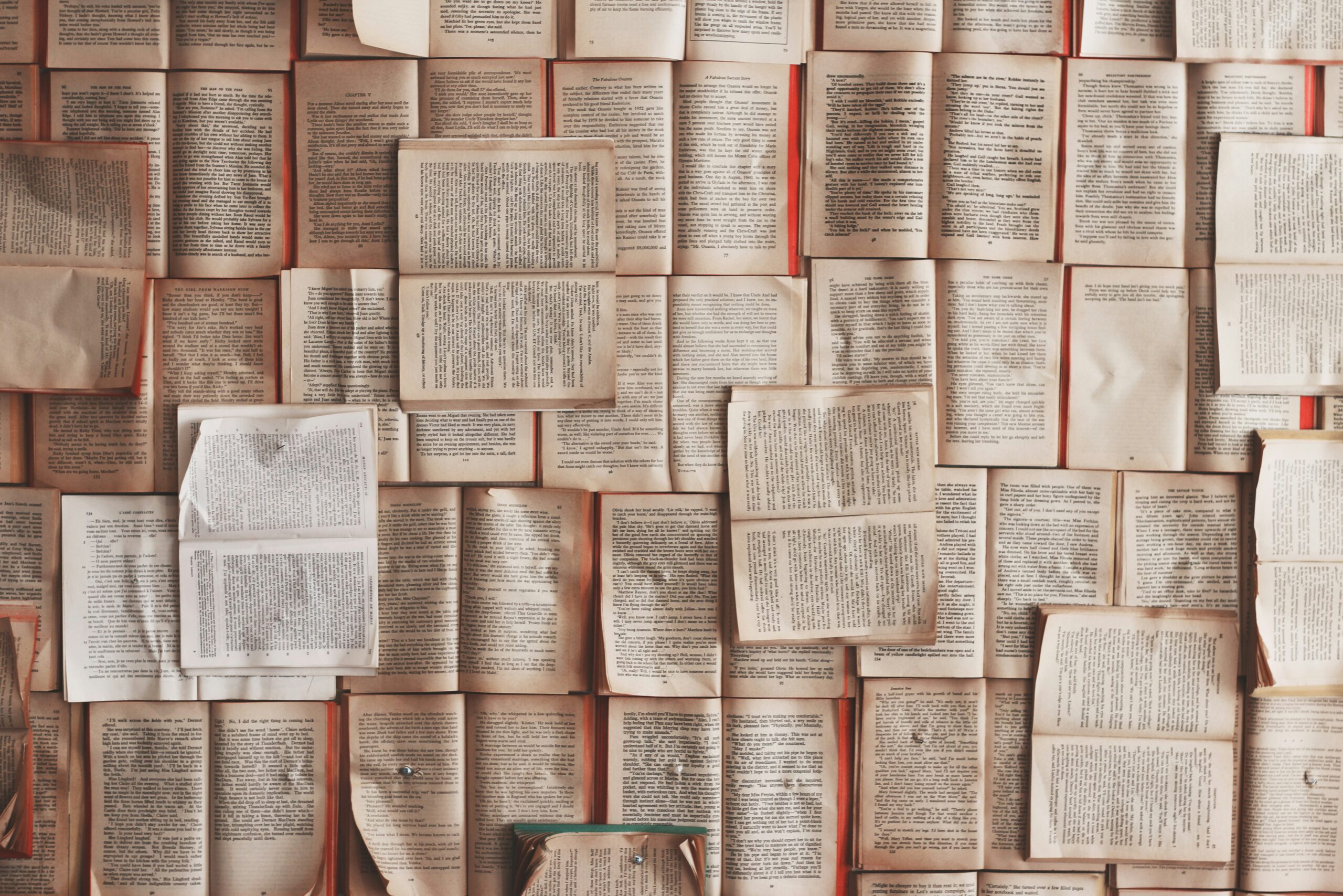 A photo shows several open books, taken on March 7, 2016 (Patrick Tomasso/Unsplash)