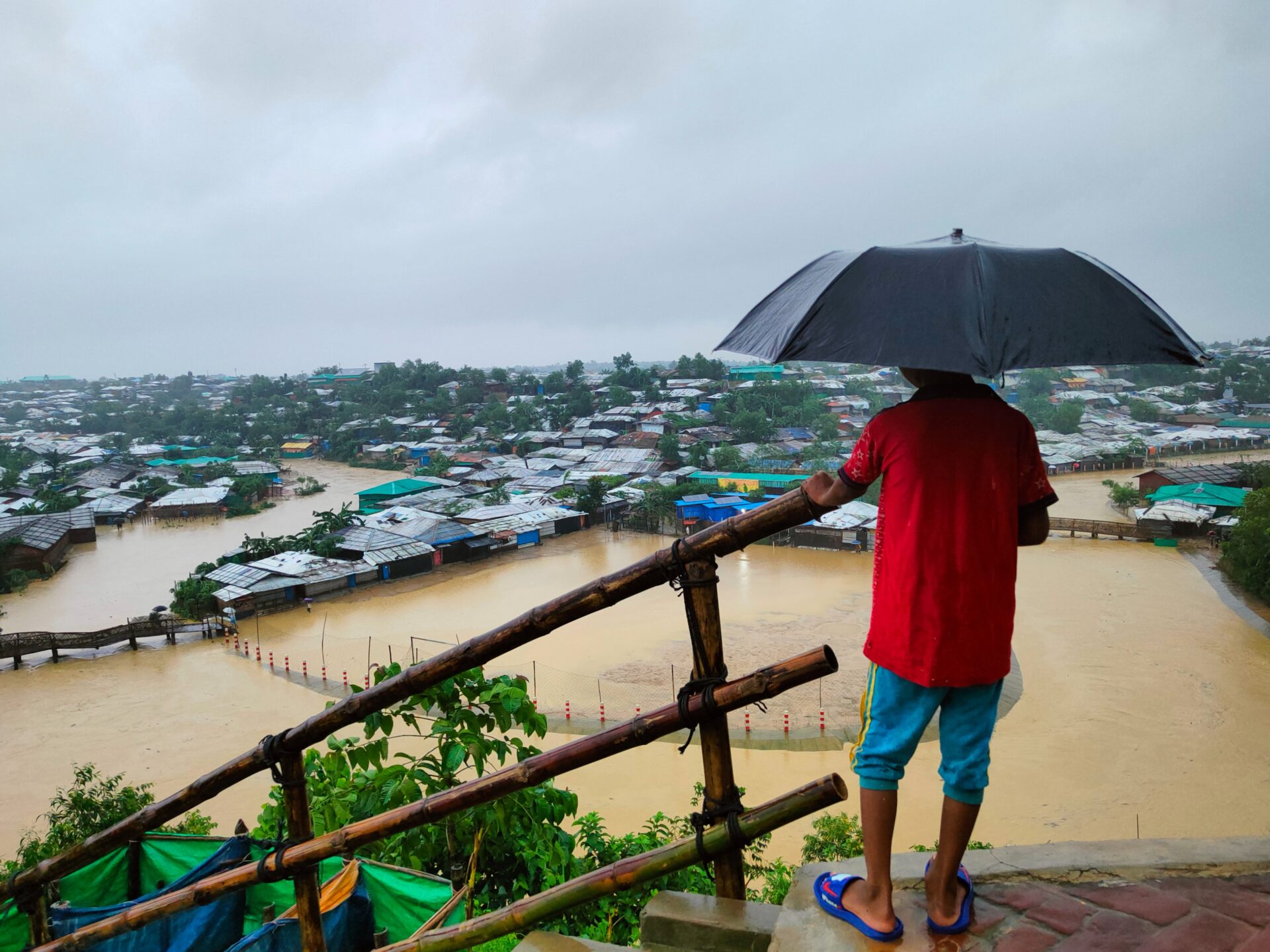 A man looks out over the flood-devastated refugee camp that houses Rohingya refugees (Sahat Zia Hero)