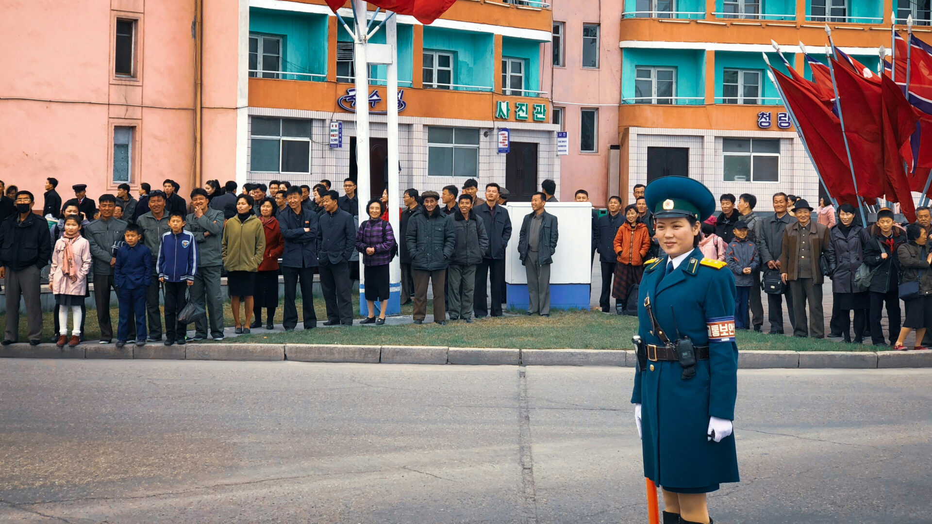 A traffic warden marshals the Pyongyang Marathon in North Korea (Thomas Evans via Unsplash)