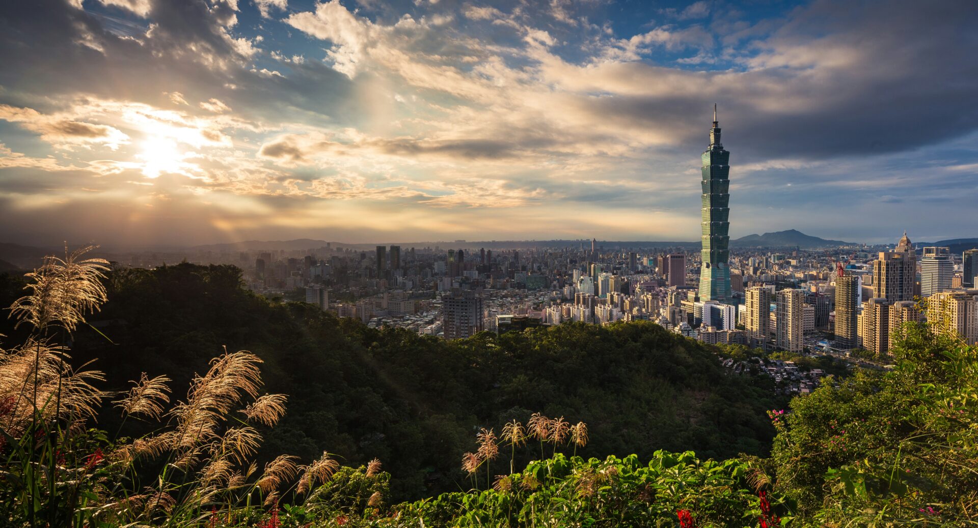 A photo shows the sunset over Tapei City, in Taiwan, on Aug. 1, 2016 (Thomas Tucker via Unsplash)